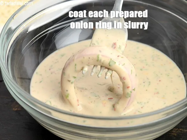 Step 19 – Coat each prepared onion ring in plain flour- slurry.