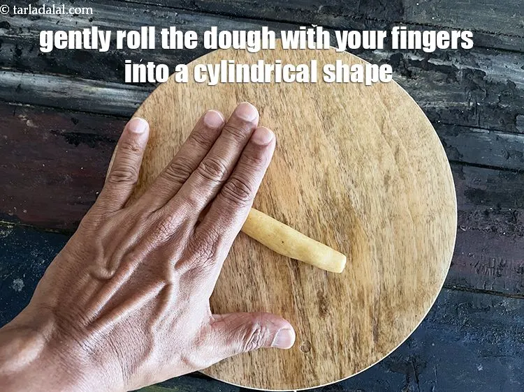 Step 22 – Gently roll the dough with your fingers into a cylinderical shape.