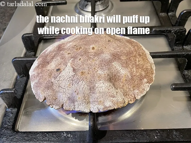 Step 19 – The bhakri should puff up on the open flame.&nbsp;
