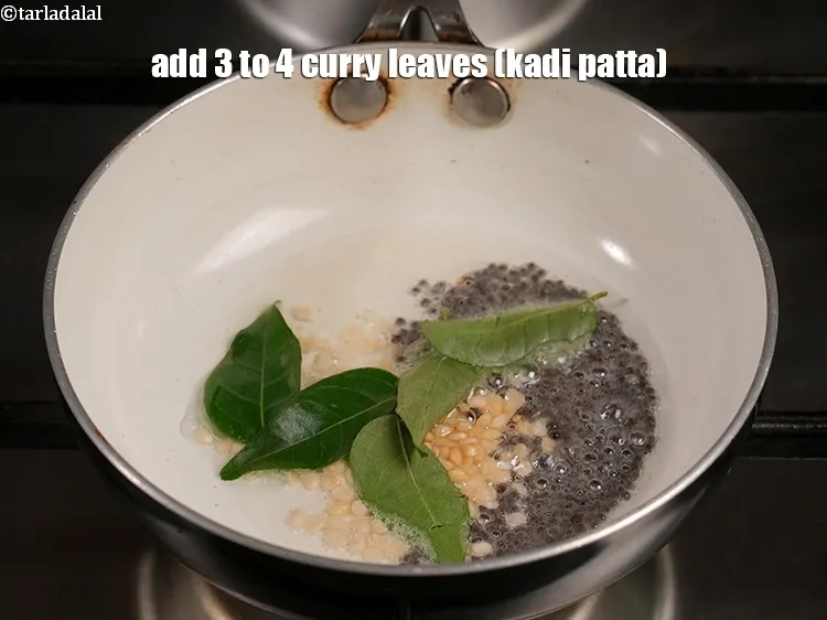Step 19 – Add&nbsp;<meta charset="UTF-8" />3 to 4&nbsp;<a href="glossary-curry-leaves-kadi-patta-kadipatta-388i">curry leaves (kadi patta)</a>.