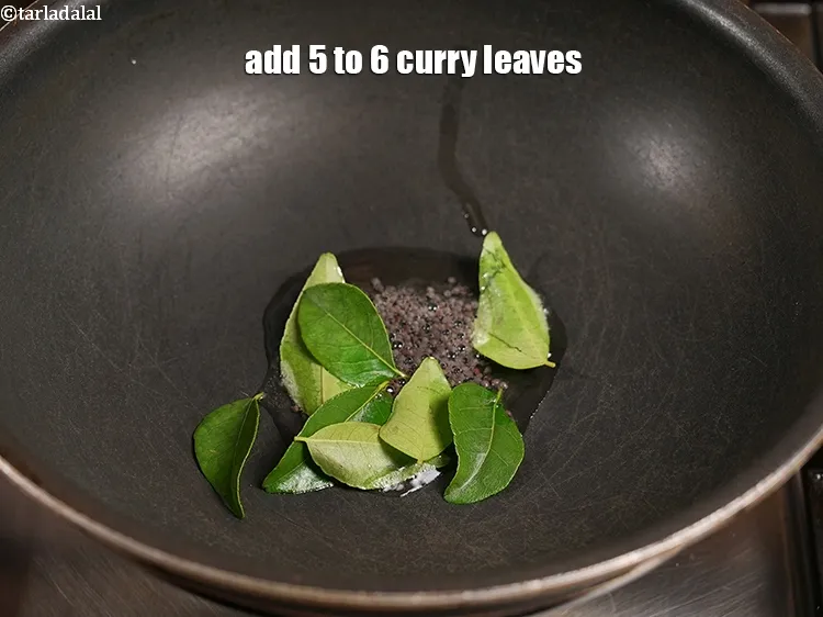 Step 23 – Add 5 to 6 curry leaves.