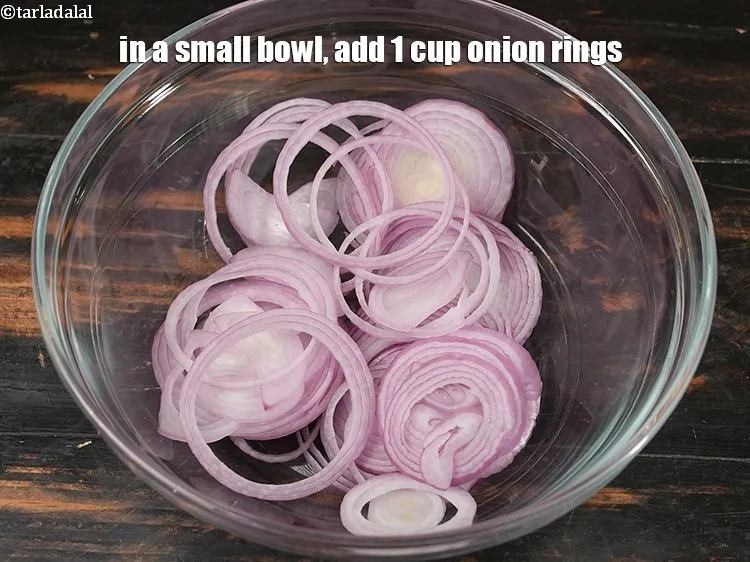 Step 21 – In a small bowl, add 1 cup <a href="https://www.tarladalal.com/glossary-onion-rings-987i">onion rings</a>.