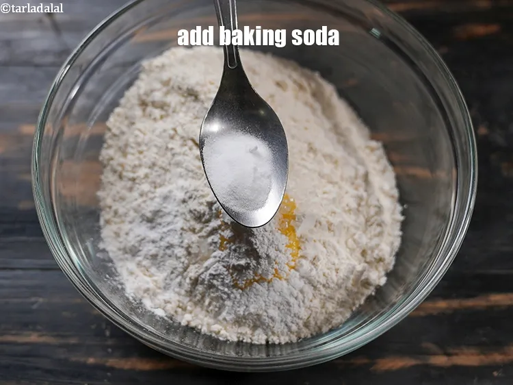 Step 19 – Add &frac12; tsp <a href="https://www.tarladalal.com/glossary-baking-soda-soda-bi-carb-615i">baking soda</a>.