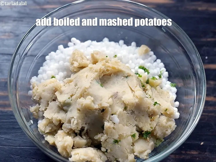Step 19 – Add 1&frac12; cups <a href="https://www.tarladalal.com/glossary-boiled-and-mashed-potatoes-1831i">boiled and mashed potatoes</a>.