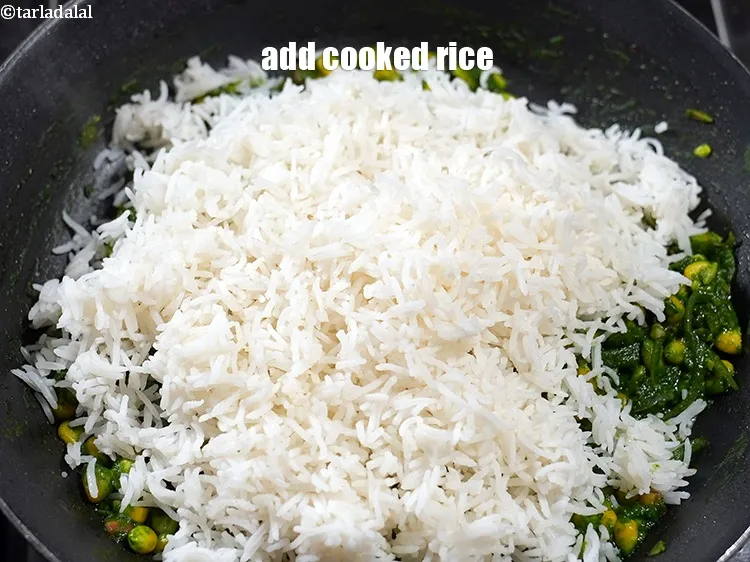 Step 23 – Add 3 cups&nbsp;<a href="https://www.tarladalal.com/glossary-soaked-and-cooked-long-grain-rice--1904i">cooked basmati rice</a>.