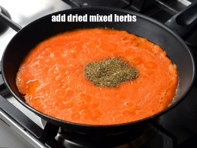 Step 21 – Add 1 tsp <a href="https://www.tarladalal.com/glossary-dried-mixed-herbs-466i">dried mixed herbs</a>.&nbsp;