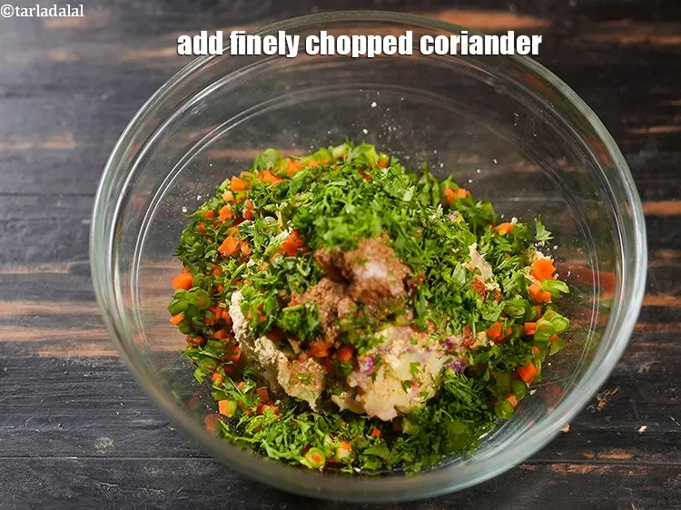 Step 19 – Add 2 tbsp finely <a href="https://www.tarladalal.com/glossary-chopped-coriander-783i">chopped coriander (dhania)</a>.&nbsp;