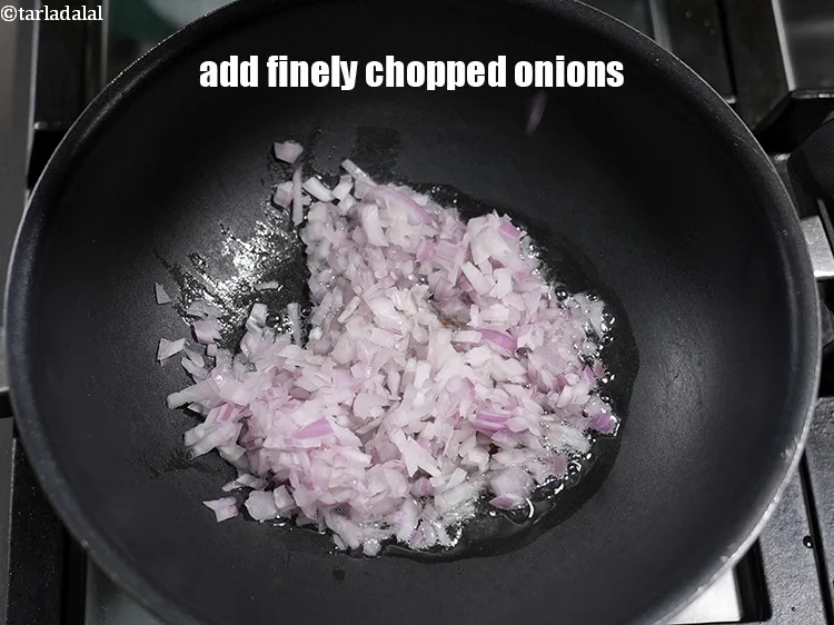 Step 18 – Add &frac12; cup finely <a href="https://www.tarladalal.com/glossary-chopped-onions-722i">chopped onions</a>.
