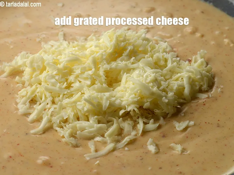 Step 20 – Add &frac14; cup grated processed cheese.