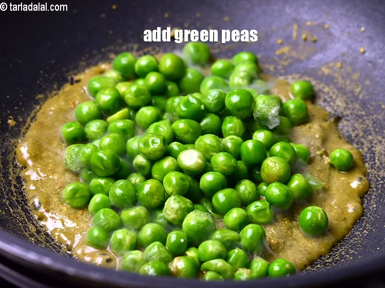 Step 18 – Add &frac12; cup <a href="https://www.tarladalal.com/glossary-green-peas-matar-hare-matar-vatana-180i">green peas</a>.