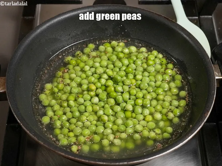 Step 20 – Add&nbsp;2 cups&nbsp;<a href="https://www.tarladalal.com/glossary-green-peas-matar-hare-matar-vatana-180i">green peas</a>.