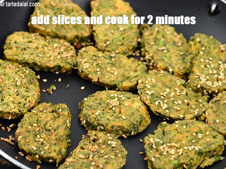 Step 19 – Add the slices and cook on a medium flame for 2 minutes.&nbsp;