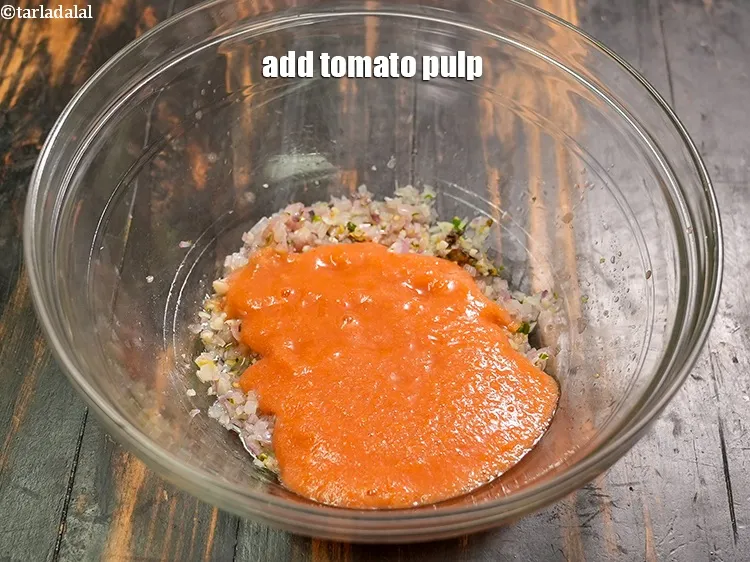 Step 18 – Add &frac12; cup <a href="https://www.tarladalal.com/glossary-tomato-pulp-tamatar-ka-pulp-1039i">tomato pulp</a>.