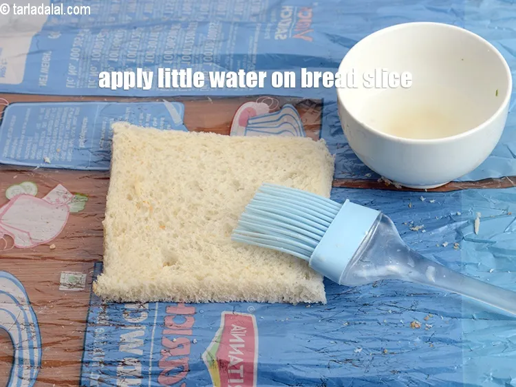 Step 19 – Apply little water on the bread slice.