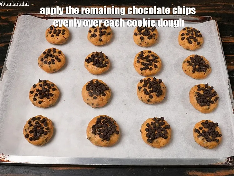 Step 19 – Apply the remaining chocolate chips evenly over each cookie dough.