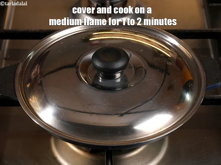 Step 19 – Cover and cook on a medium flame for 1 to 2 minutes.