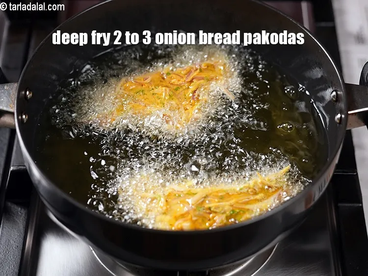 Step 20 – Deep fry 2 to 3 onion bread pakodas at a time.