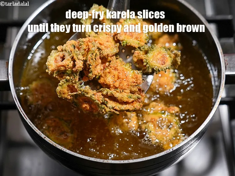 Step 19 – Next, heat <a href="https://www.tarladalal.com/glossary-oil-671i">oil</a>&nbsp;for deep-frying in a deep non-stick pan and deep-fry a few karela …