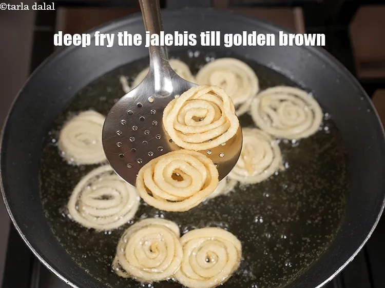 Step 21 – Deep fry the jalebis till golden brown.