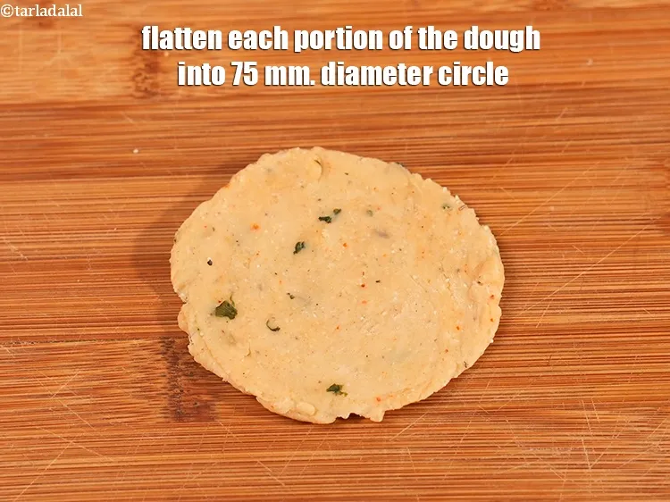 Step 19 – Flatten each portion of the dough into 75 mm. (3 inch) diameter circle.&nbsp;