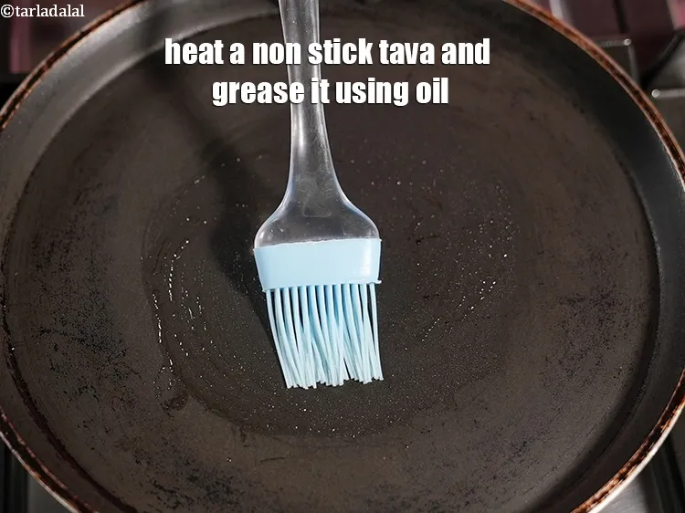 Step 18 – Heat a non stick tava (griddle) and grease it using &frac14; tsp oil.