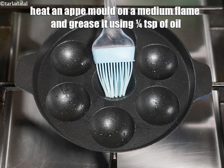Step 20 – Heat an appe mould on a medium flame and grease it using &frac14; tsp of …