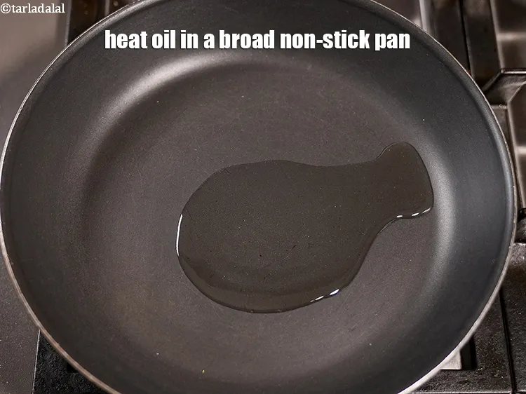 Step 18 – Heat 1 tbsp&nbsp;<a href="https://www.tarladalal.com/glossary-oil-671i">oil</a> in a broad non-stick pan.