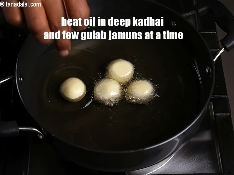 Step 20 – Heat the oil in a deep non-stick kadhai and deep-fry, few gulab jamuns at a …