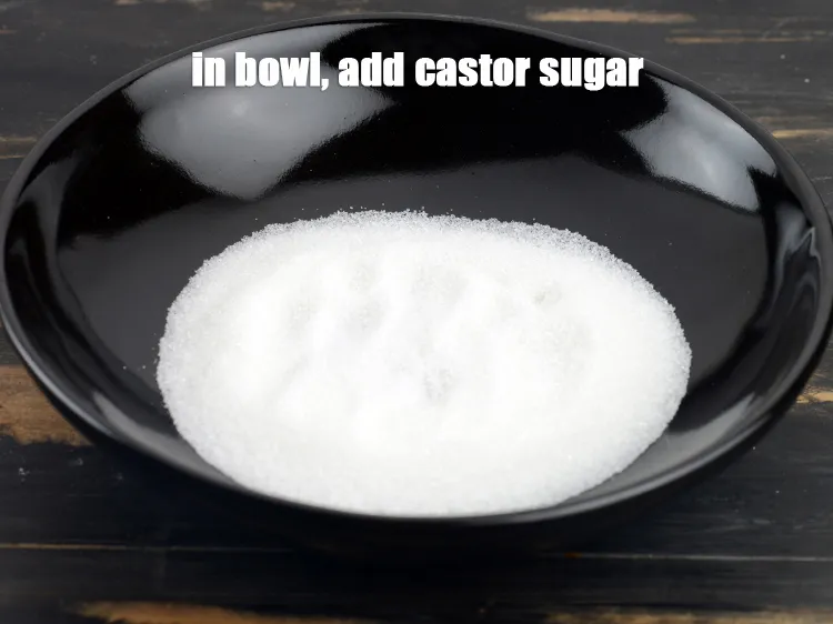 Step 19 – In another bowl, add &frac12; cup <a href="https://www.tarladalal.com/glossary-castor-sugar-279i">castor sugar</a>&nbsp;.