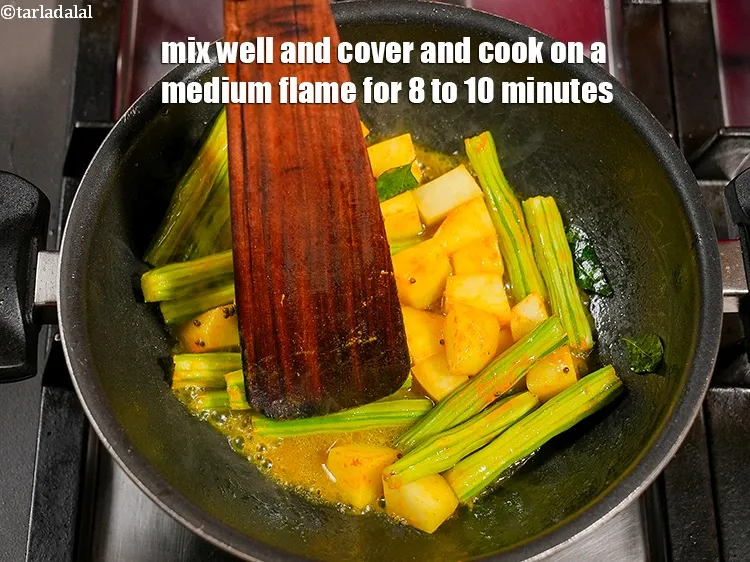 Step 19 – Mix well and cover and cook on a medium flame for 8 to 10 minutes.