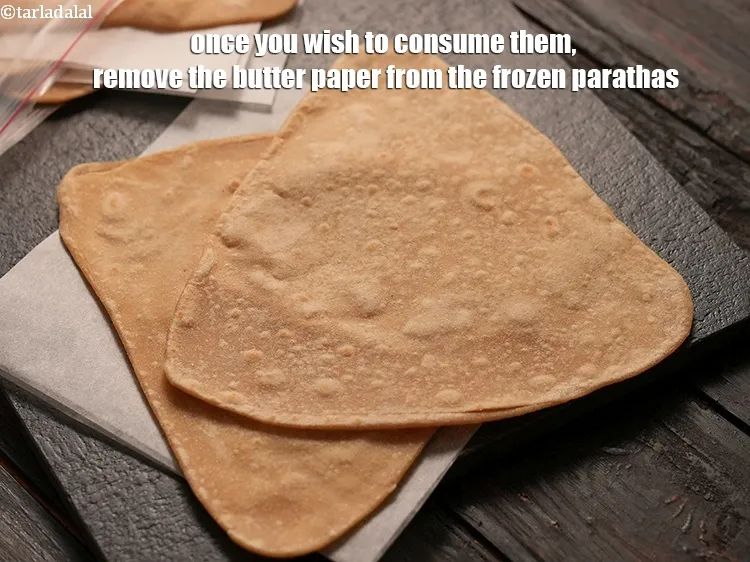 Step 22 – Once you wish to consume them, remove the butter paper from the frozen parathas.