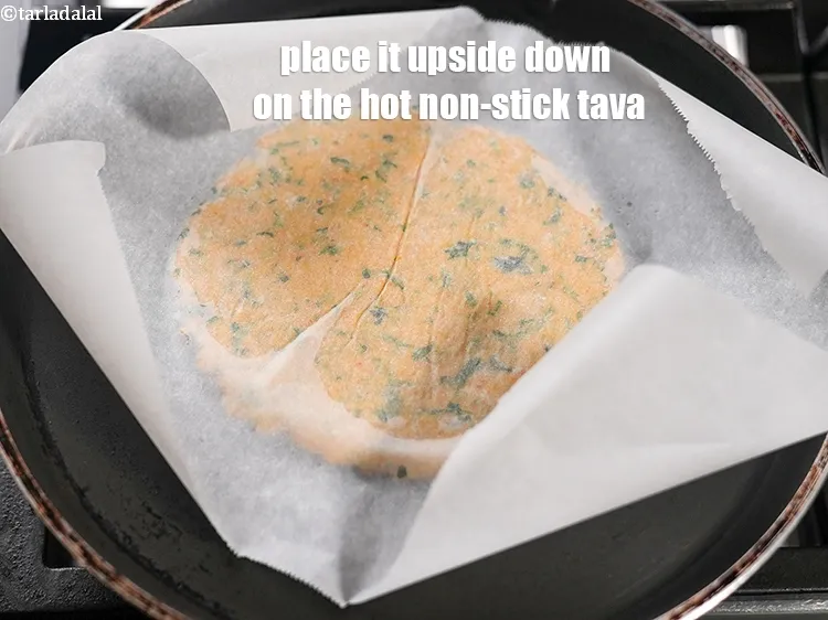 Step 19 – Place it upside down on the hot non-stick tava.&nbsp;