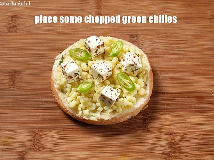 Step 19 – Place some chopped green chilies.