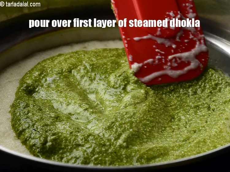 Step 20 – Pour over the first layer of steamed dhokla.