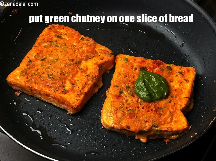 Step 20 – Put &frac12; tbsp <a href="https://www.tarladalal.com/green-chutney-22266r">green chutney</a> on one slice of bread.