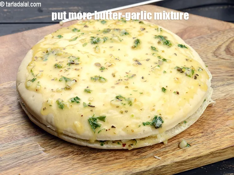 Step 19 – Put little more butter-garlic mixture evenly over it.