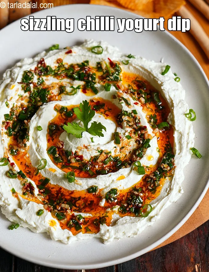 Step 19 – Serve the <strong>chilli oil curd dip</strong> with crackers, chips, toast or bread of your choice.