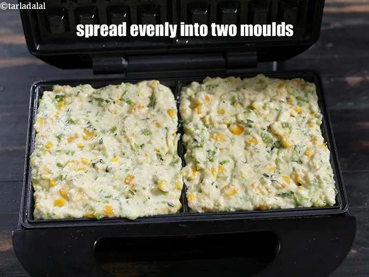 Step 19 – Spread evenly into two greased waffle moulds.