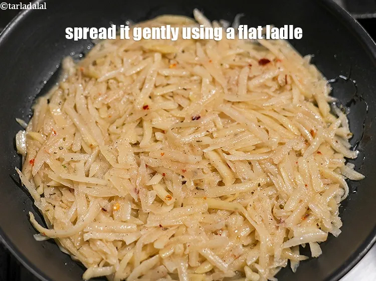 Step 19 – Spread it gently using a flat ladle to form a 150 mm. (6&rdquo;) diameter circle.