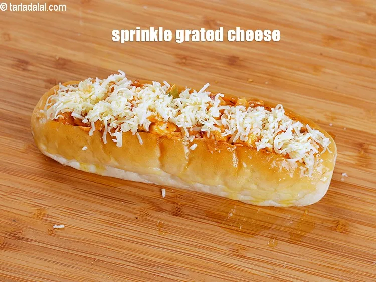 Step 20 – Finally sprinkle 2 tbsp grated cheese evenly over it.&nbsp;