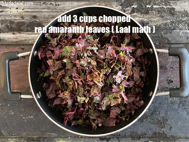 Step 32 – Add 3 cups chopped red amaranth leaves (laal math).