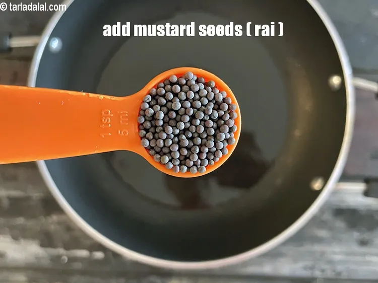 Step 21 – Add&nbsp;<meta charset="UTF-8" />1 tsp&nbsp;<a href="glossary-mustard-seeds-sarson-rai-sarson-ke-beej-525i">mustard seeds ( rai / sarson)</a>.
