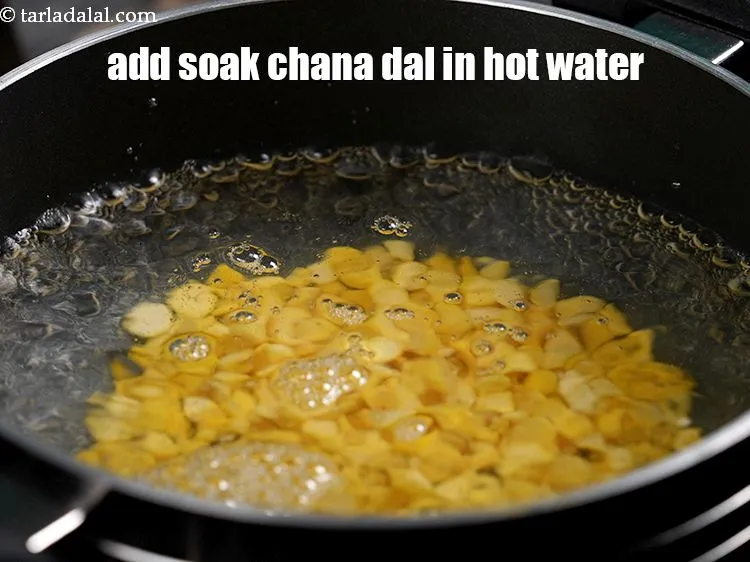 Step 20 – In a deep non-stick pan, add the chana dal.&nbsp;