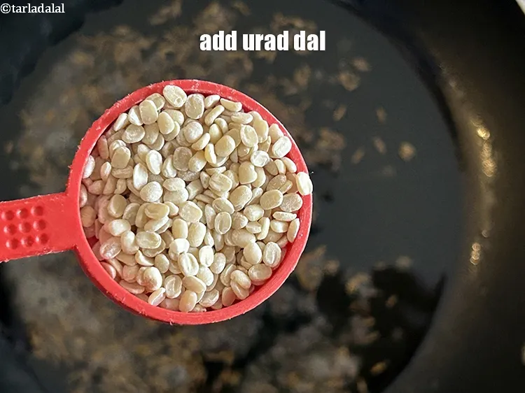 Step 19 – <html><head></head><body><p>Add&nbsp;1 tbsp&nbsp;<a href="glossary-urad-dal-split-black-lentil-941i">urad dal (split black lentils)</a>.</p></body></html>