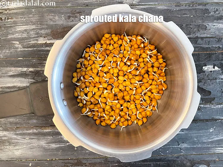 Step 27 – In a pressure cooker, put&nbsp;<meta charset="UTF-8" />1 1/2 cups&nbsp;<a href="glossary-sprouted-kala-chana-1111i">sprouted kala chana (brown chick peas)</a>.