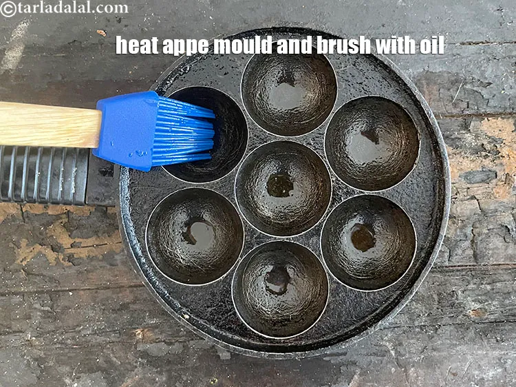 Step 22 – <meta charset="UTF-8" />Heat an appe mould on a medium flame and grease it with a …
