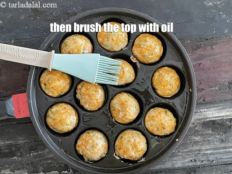 Step 24 – Then brush the top of the appe with oil.