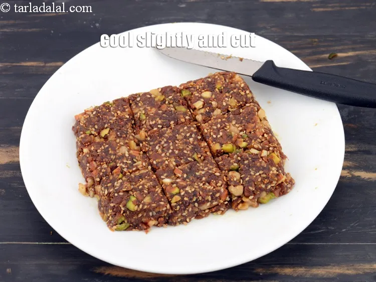 Step 19 – Cool slightly and cut into 9 equal square-shaped pieces.