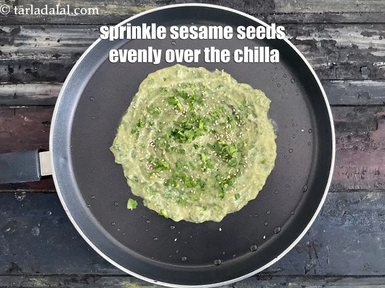 Step 30 – Sprinkle &frac12; tsp of sesame seeds evenly over it.