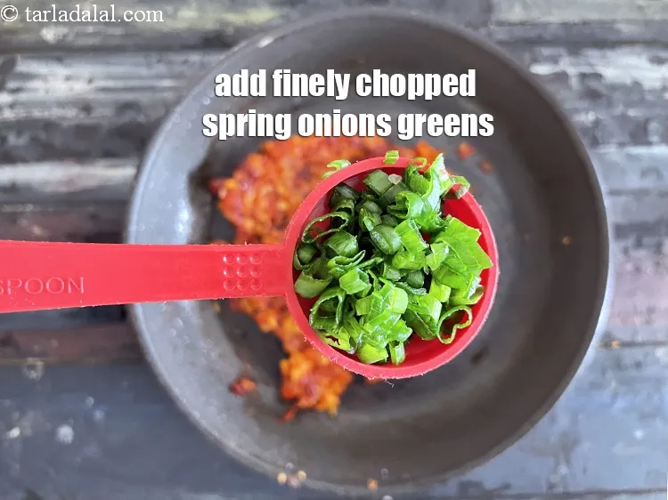 Step 19 – Add&nbsp;<meta charset="UTF-8" />1 tbsp&nbsp;finely&nbsp;<a href="glossary-chopped-spring-onion-greens-1030i">chopped spring onion greens</a>.